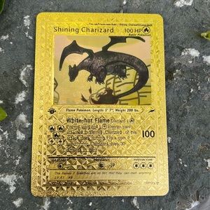 1st edition gold shinning Charizard Pokémon card